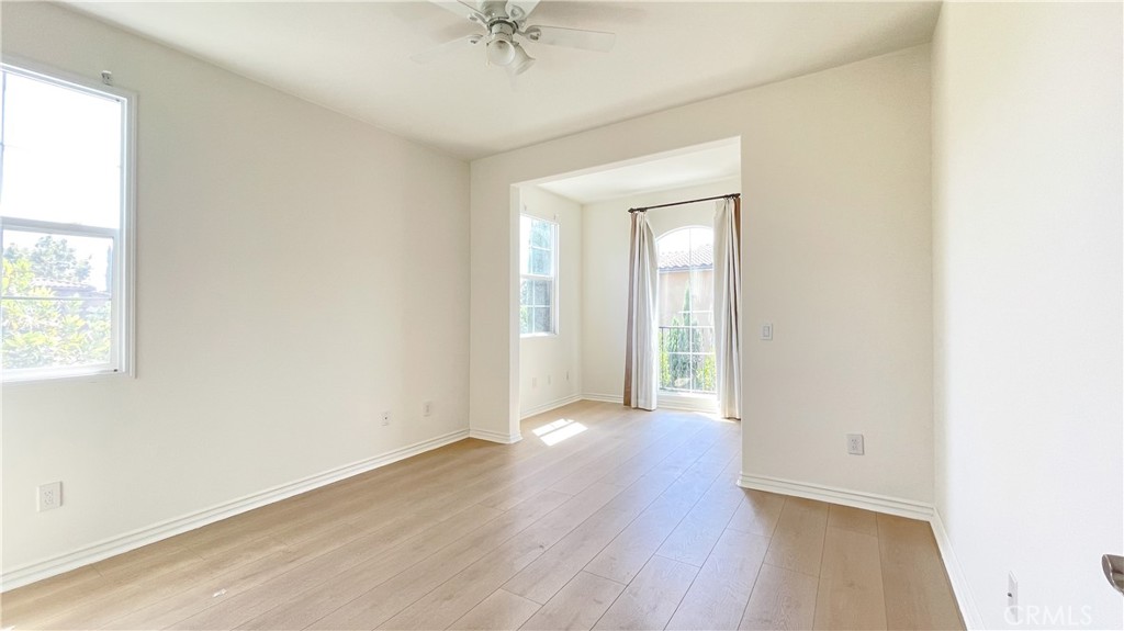 21 Vine Irvine, CA 92620 - Photo 27 of 37 an empty room with wooden floor and windows