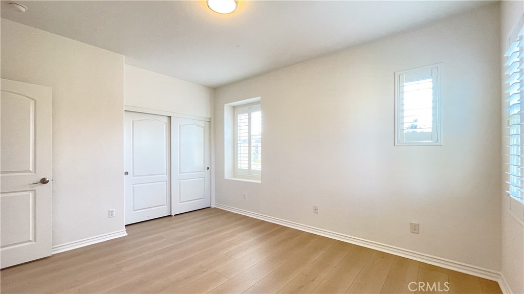 21 Vine Irvine, CA 92620 - Photo 31 of 37 an empty room with wooden floor and windows