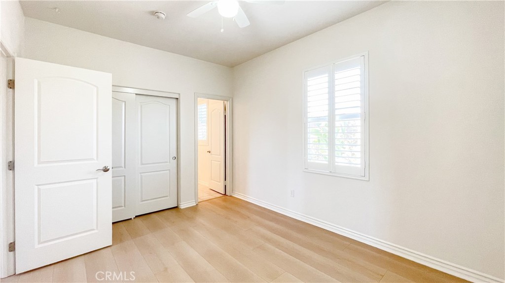 21 Vine Irvine, CA 92620 - Photo 32 of 37 an empty room with wooden floor and windows