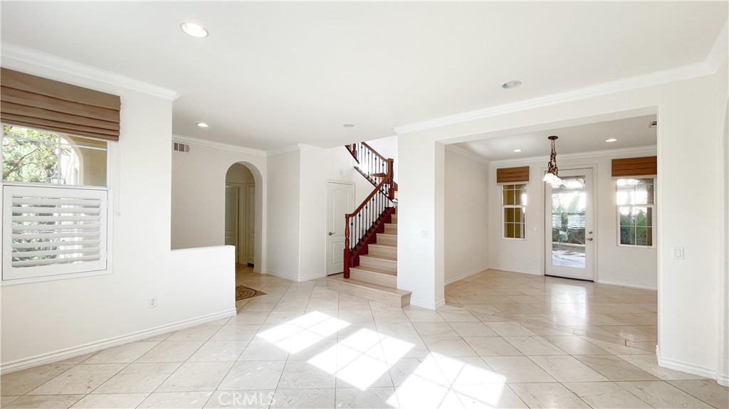 21 Vine Irvine, CA 92620 - Photo 7 of 37 a view of an entryway with wooden floor and a livingroom
