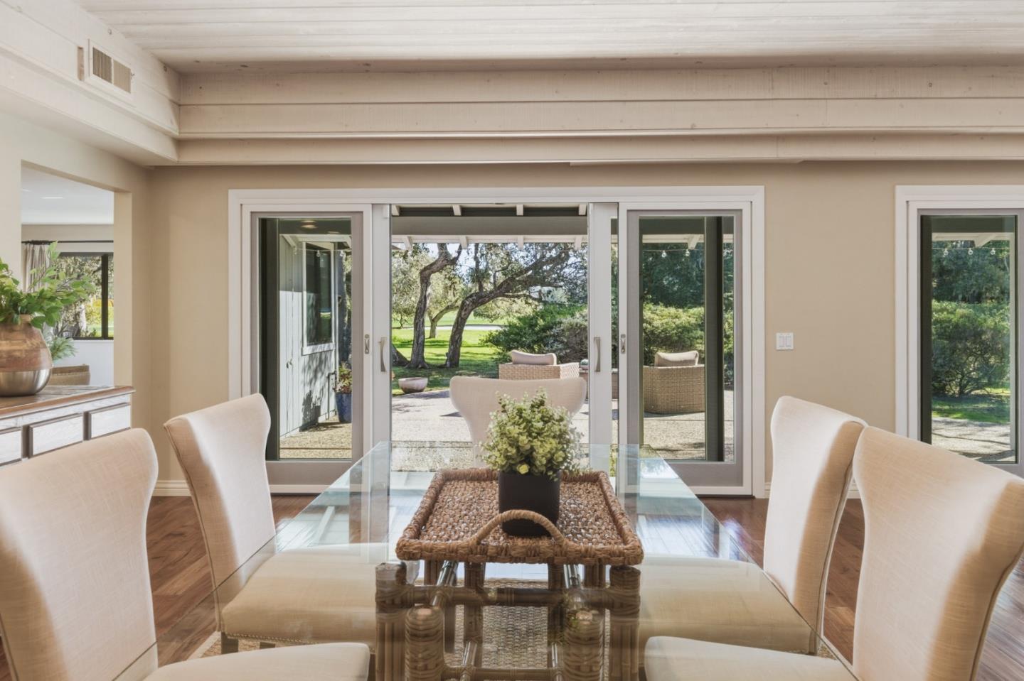 1057 Broncho Road Pebble Beach, CA 93953 - Photo 12 of 21 a view of a dining room with furniture window and wooden floor