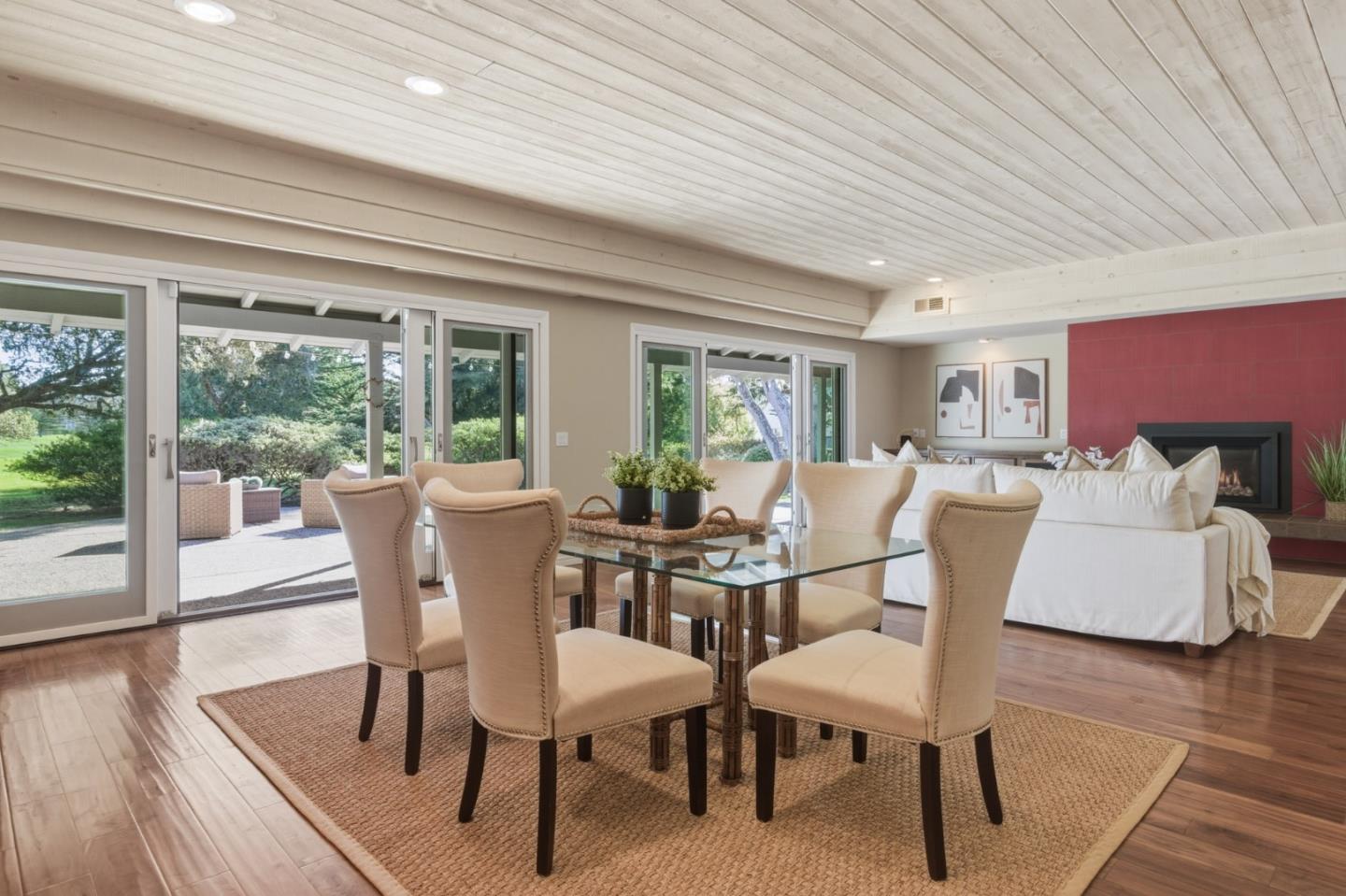 1057 Broncho Road Pebble Beach, CA 93953 - Photo 13 of 21 a view of a dining room with furniture window and wooden floor