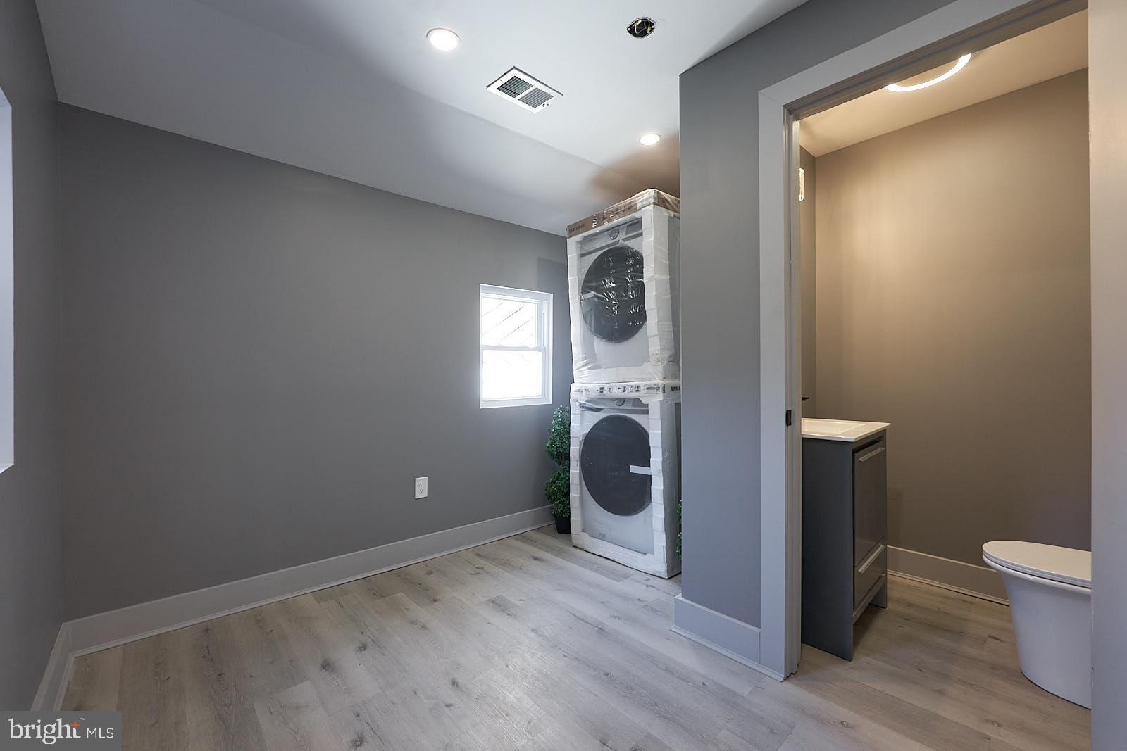 1630 North 26th Street Philadelphia, PA 19121 - Photo 27 of 50 a view of a hallway with a washer and dryer