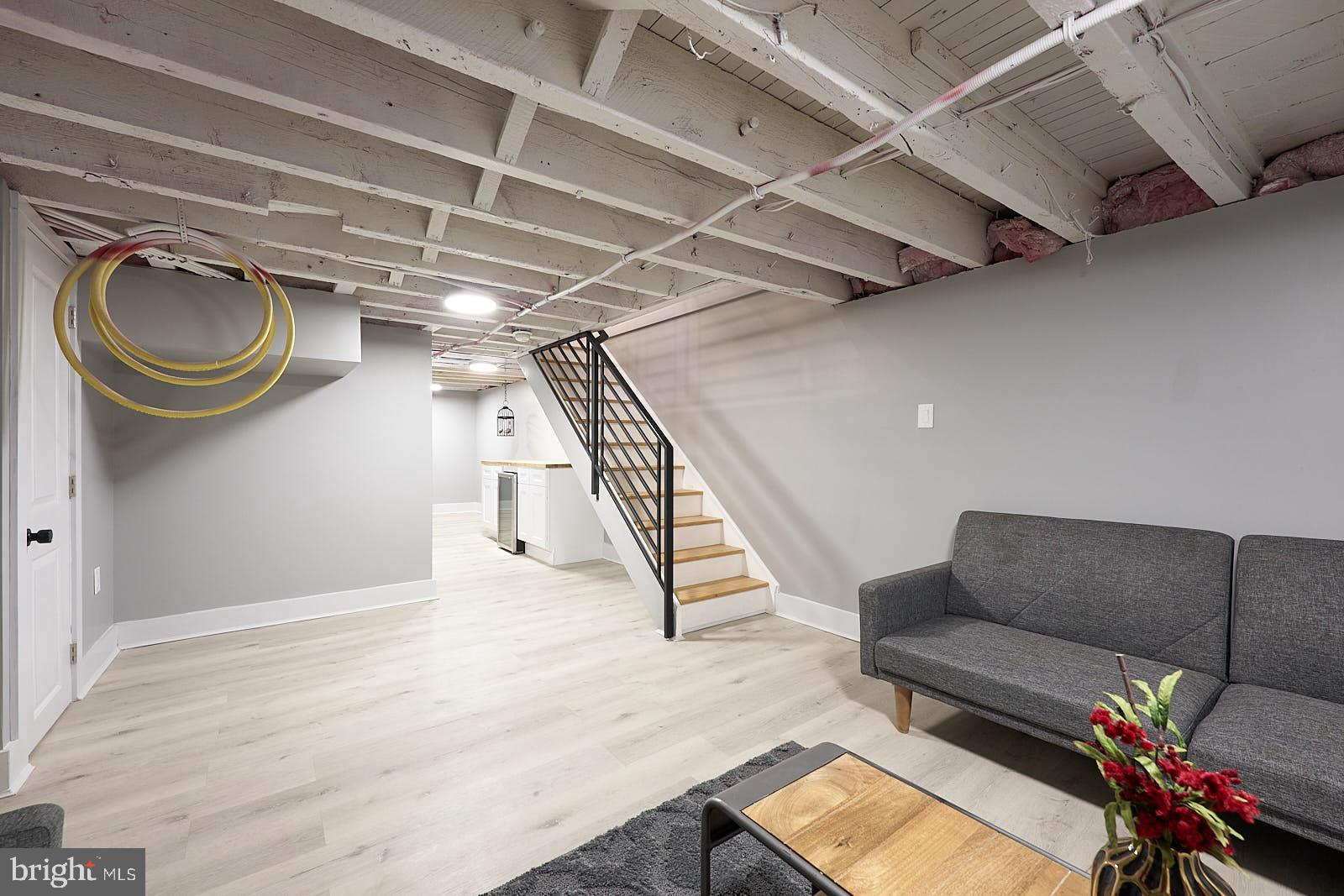 1630 North 26th Street Philadelphia, PA 19121 - Photo 33 of 50 a living room with furniture and a wooden floor