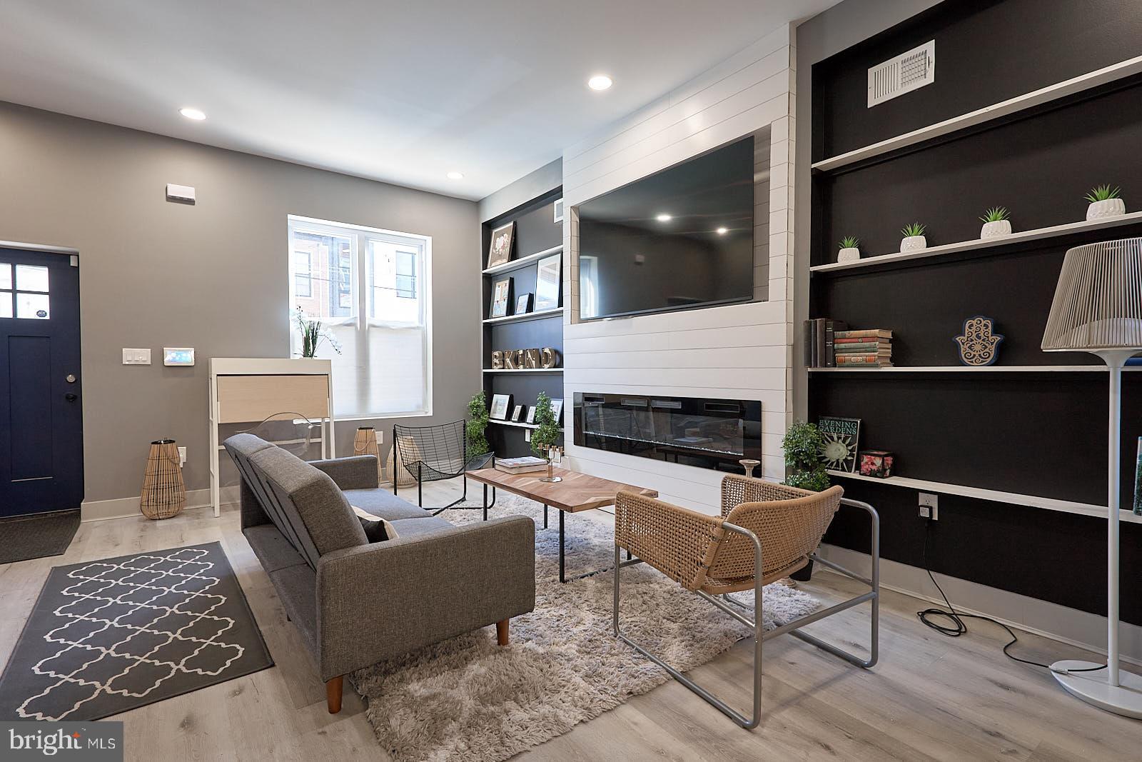 1630 North 26th Street Philadelphia, PA 19121 - Photo 5 of 50 a living room with furniture and a fireplace