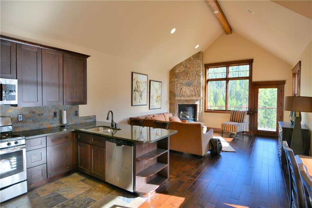 874 Independence Road, Unit 1C Keystone, CO 80435 - Photo 4 of 25 a kitchen with sink refrigerator and cabinets