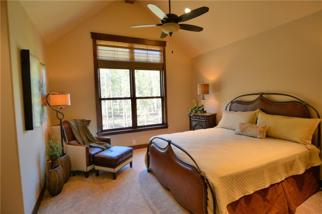 874 Independence Road, Unit 1C Keystone, CO 80435 - Photo 8 of 25 a bedroom with a bed chair and window
