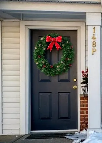 a vase of flowers sitting on a floor