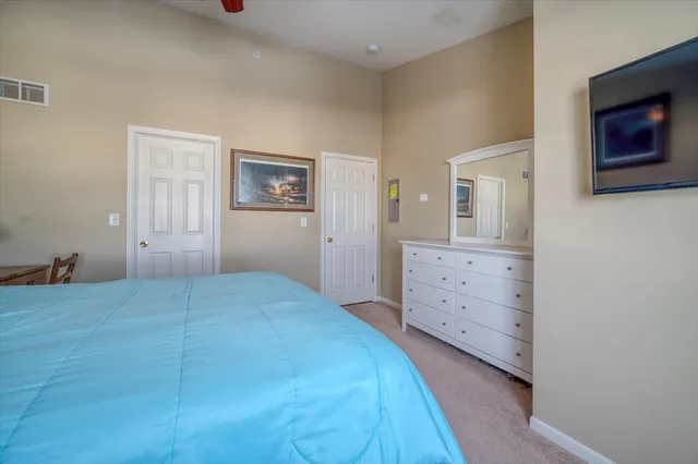 a bedroom with a bed and a cabinets