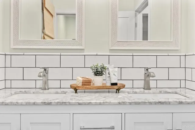 a view of a kitchen sink granite counter top
