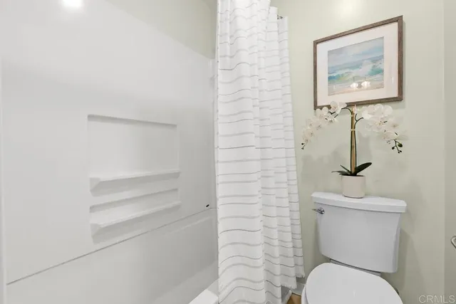 a bathroom with a toilet and a sink