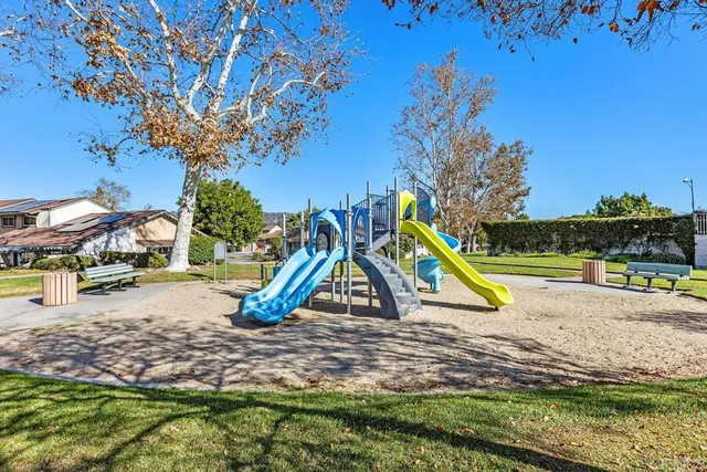 a view of outdoor space with swimming pool and slide