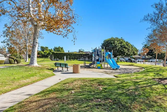 a view of a park with swings and slides