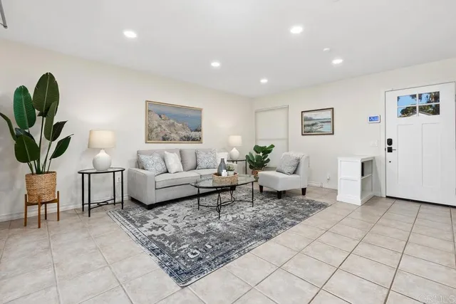 a living room with furniture and a rug