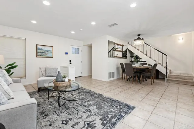 a living room with furniture and a rug