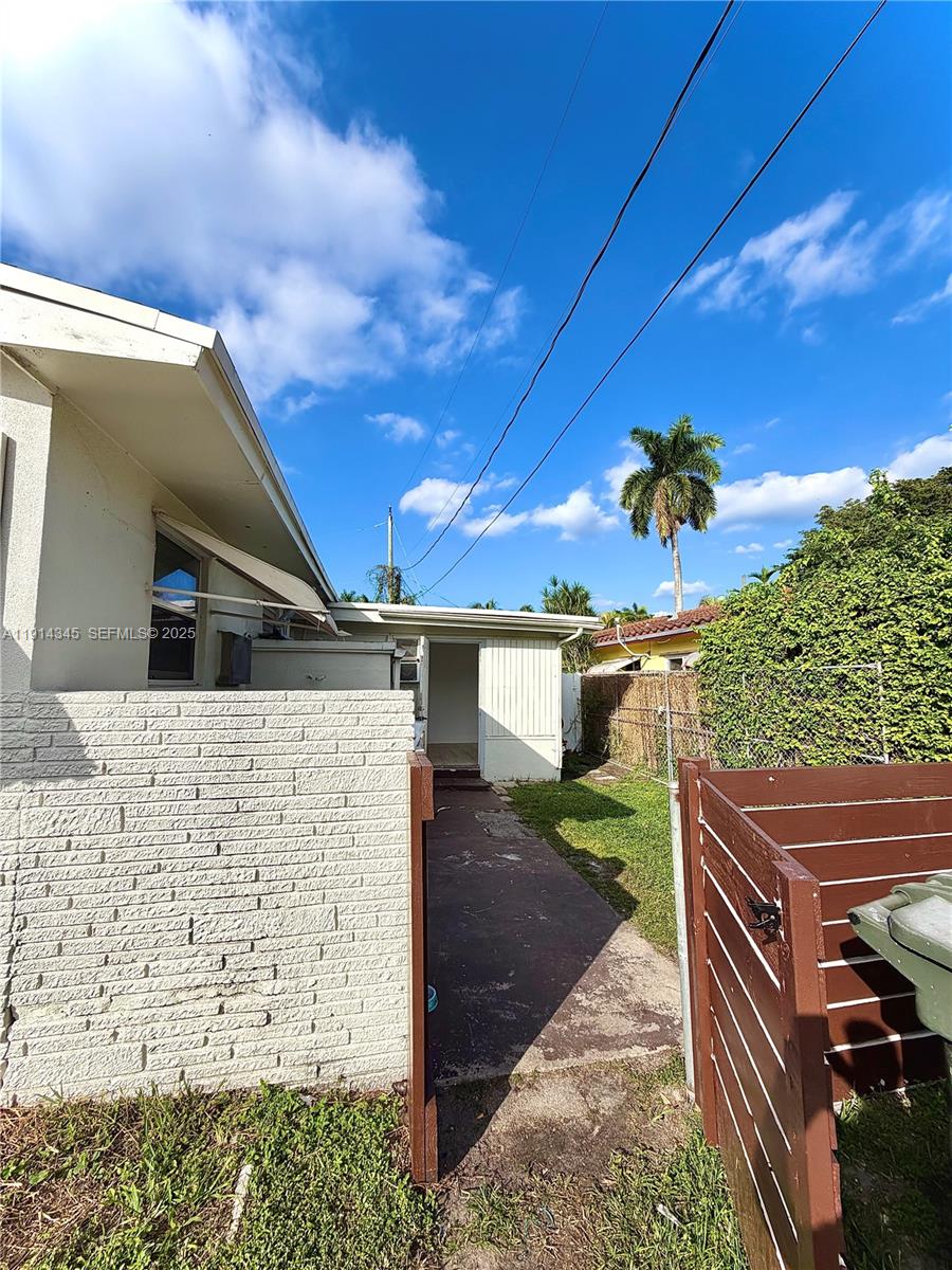 224 Southwest 10th Street, Unit 1 Hallandale Beach, FL 33009 - Photo 1 of 22 a front view of a house with a yard