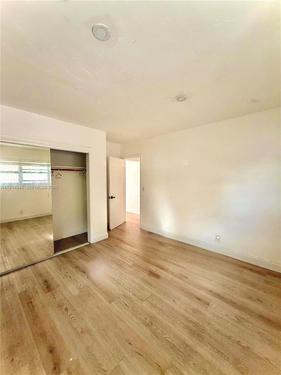 224 Southwest 10th Street, Unit 1 Hallandale Beach, FL 33009 - Photo 18 of 22 wooden floor in a room