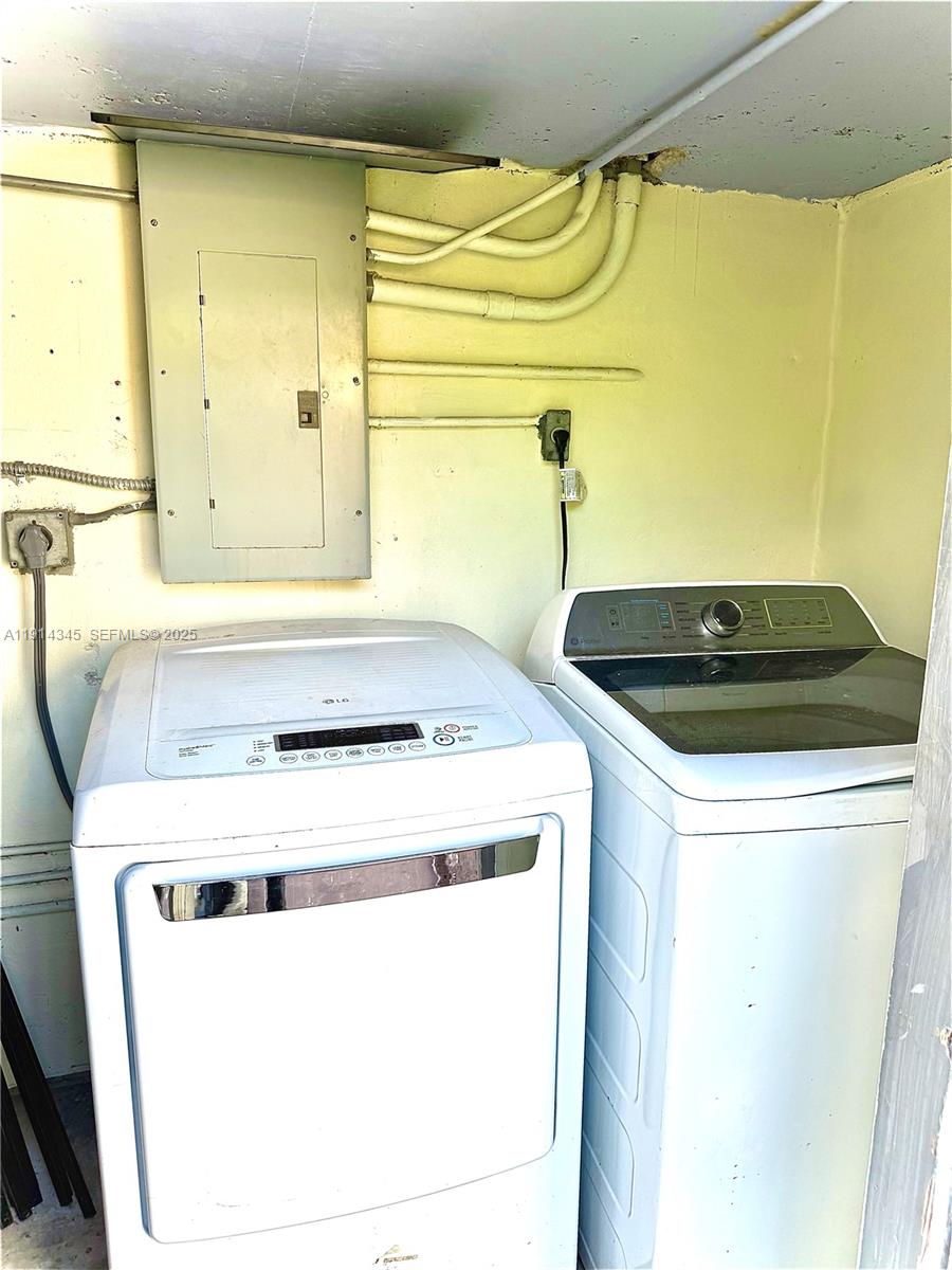 224 Southwest 10th Street, Unit 1 Hallandale Beach, FL 33009 - Photo 20 of 22 a utility room with dryer and washer