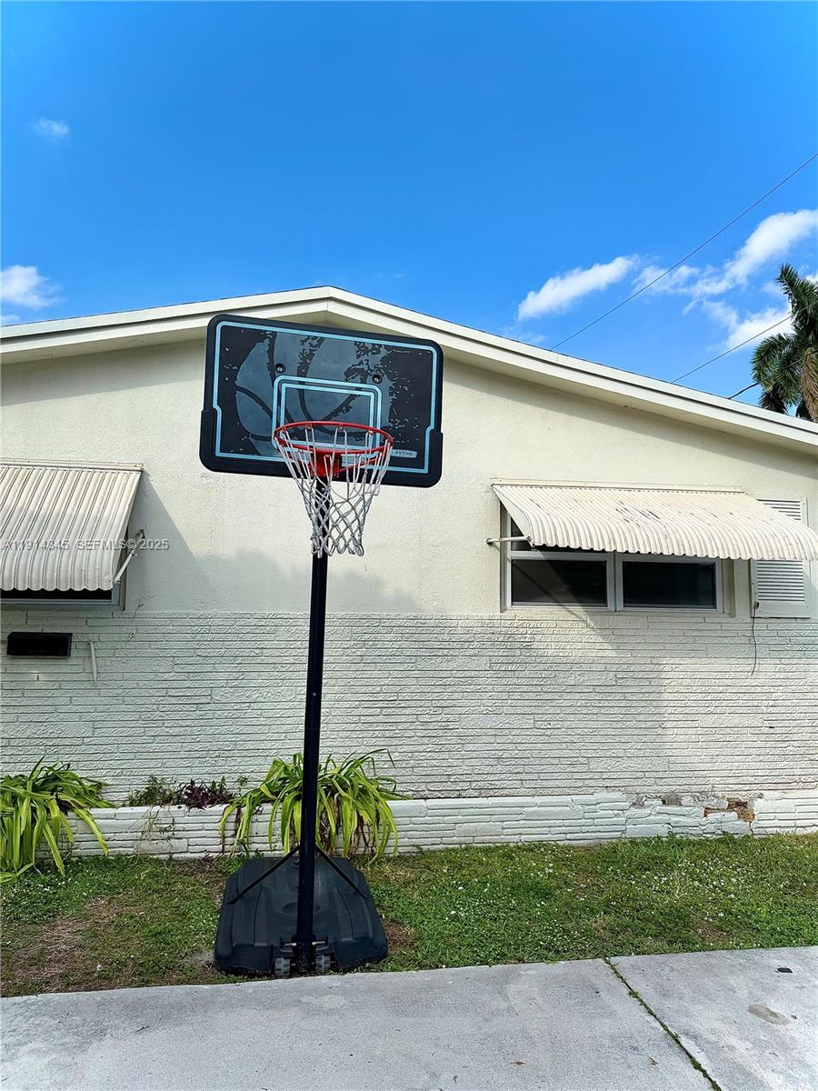 224 Southwest 10th Street, Unit 1 Hallandale Beach, FL 33009 - Photo 21 of 22 a front view of a house with parking space