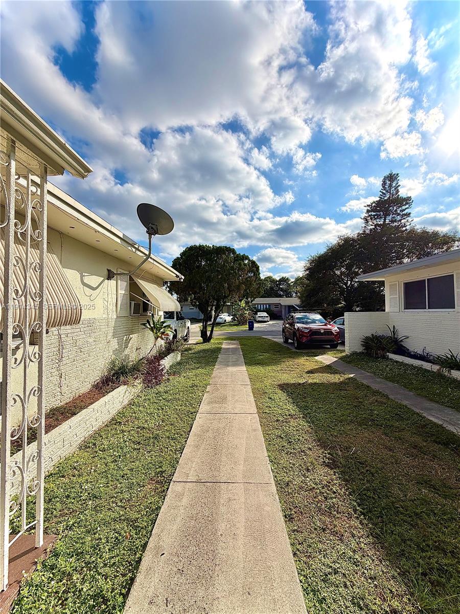 224 Southwest 10th Street, Unit 1 Hallandale Beach, FL 33009 - Photo 22 of 22 a view of outdoor space with garden