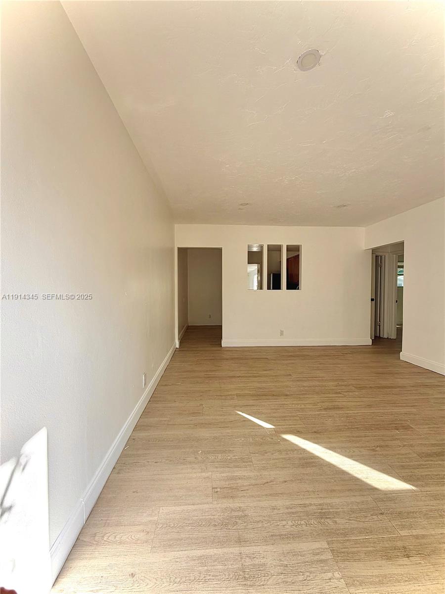 224 Southwest 10th Street, Unit 1 Hallandale Beach, FL 33009 - Photo 10 of 22 a view of an empty room
