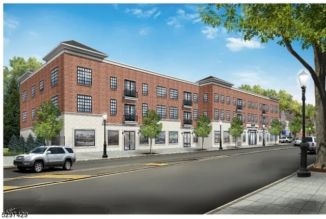 a view of building with car parked on the road