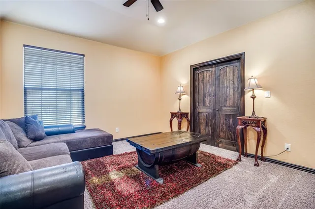 a living room with furniture a couch and a window