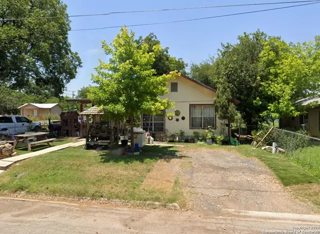 a view of a house with backyard porch and sitting area