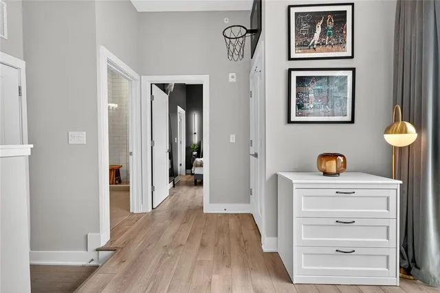 a view of walk in closet with clothes