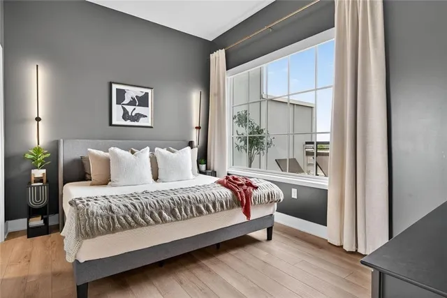 a living room with furniture and a lamp