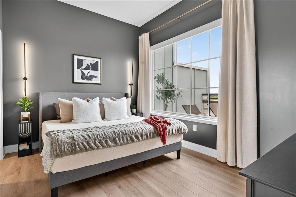 22 Airline Street Southeast, Unit PH403 Atlanta, GA 30312 - Photo 20 of 61 a bedroom with a bed and a window