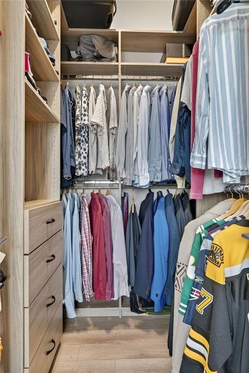 22 Airline Street Southeast, Unit PH403 Atlanta, GA 30312 - Photo 22 of 61 a view of walk in closet with clothes