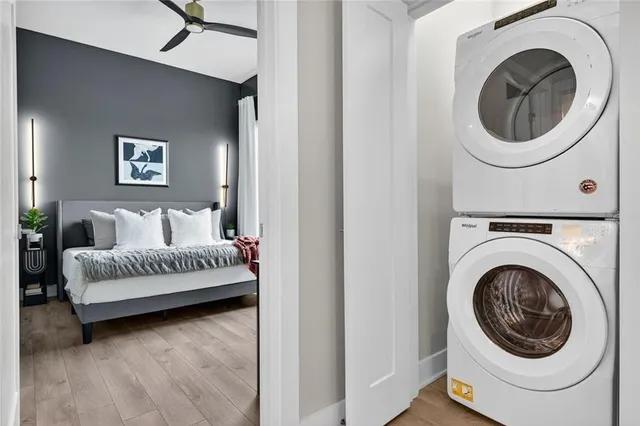 a bedroom with a bed and a large window