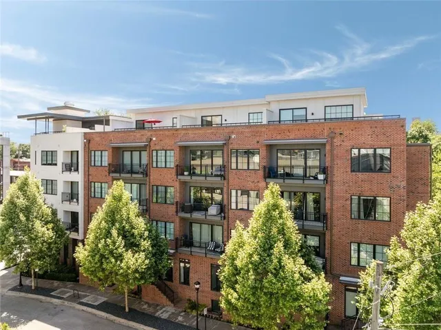 a view of a kitchen with stainless steel appliances