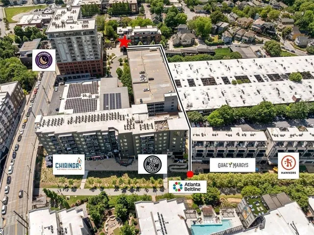 a view of a swimming pool with chairs in patio