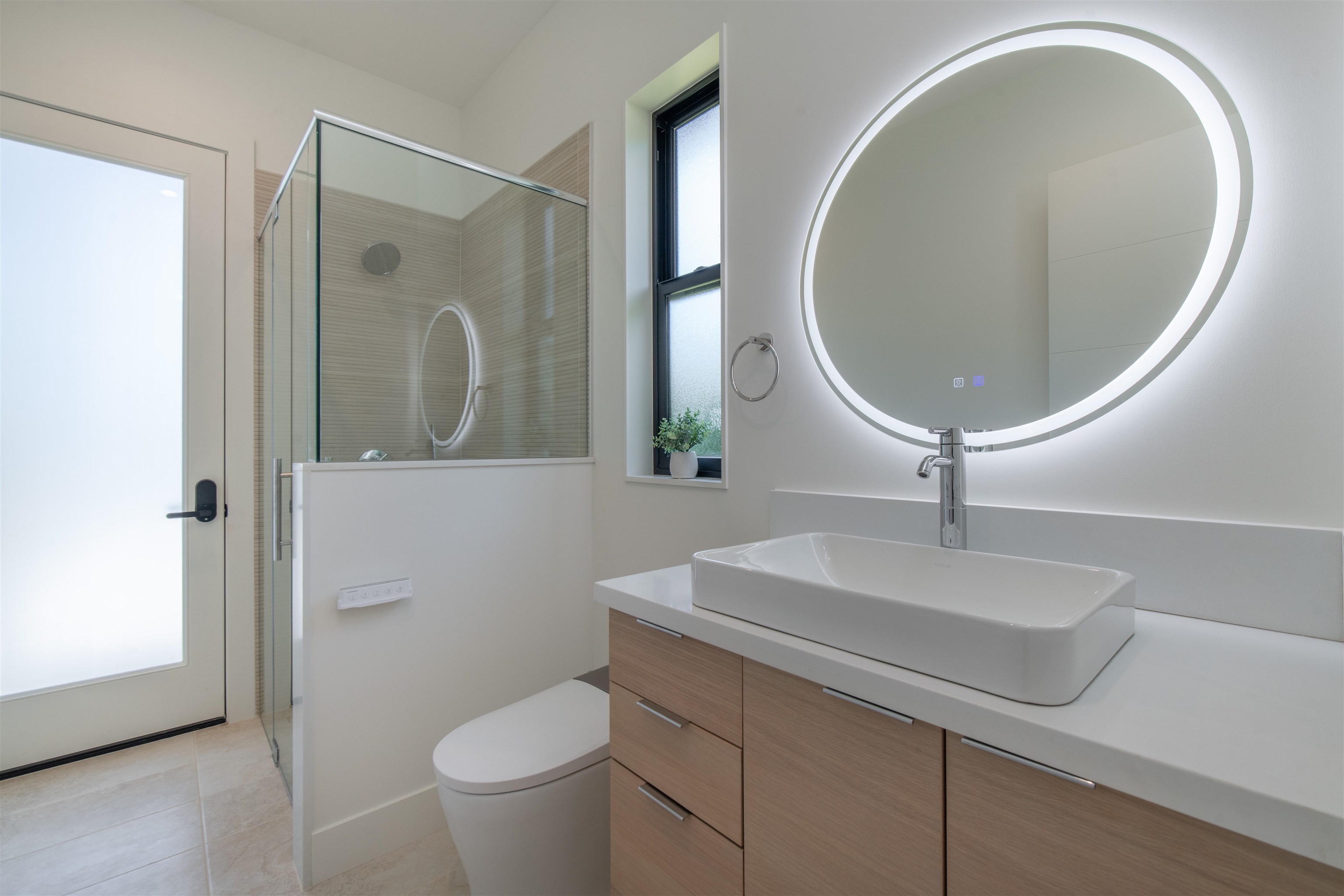 111 Mehana Road, Unit A Haiku, HI 96708 - Photo 29 of 50 a bathroom with a toilet sink and mirror