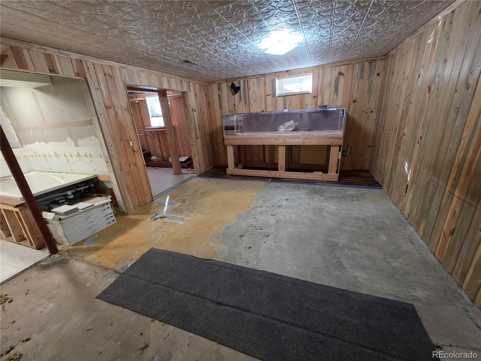 10439 Independence Street Broomfield, CO 80021 - Photo 21 of 30 a view of a livingroom with furniture and a fireplace