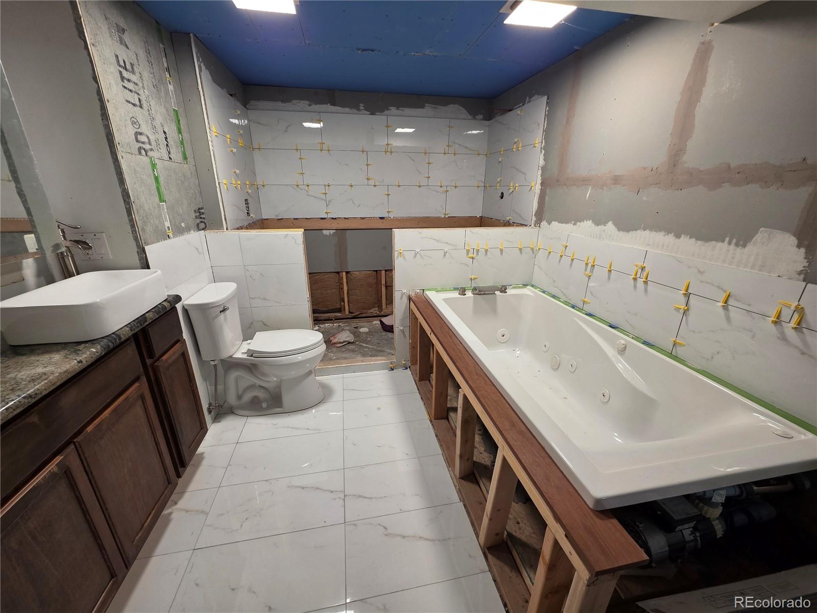 10439 Independence Street Broomfield, CO 80021 - Photo 23 of 30 a bathroom with a sink and a toilet