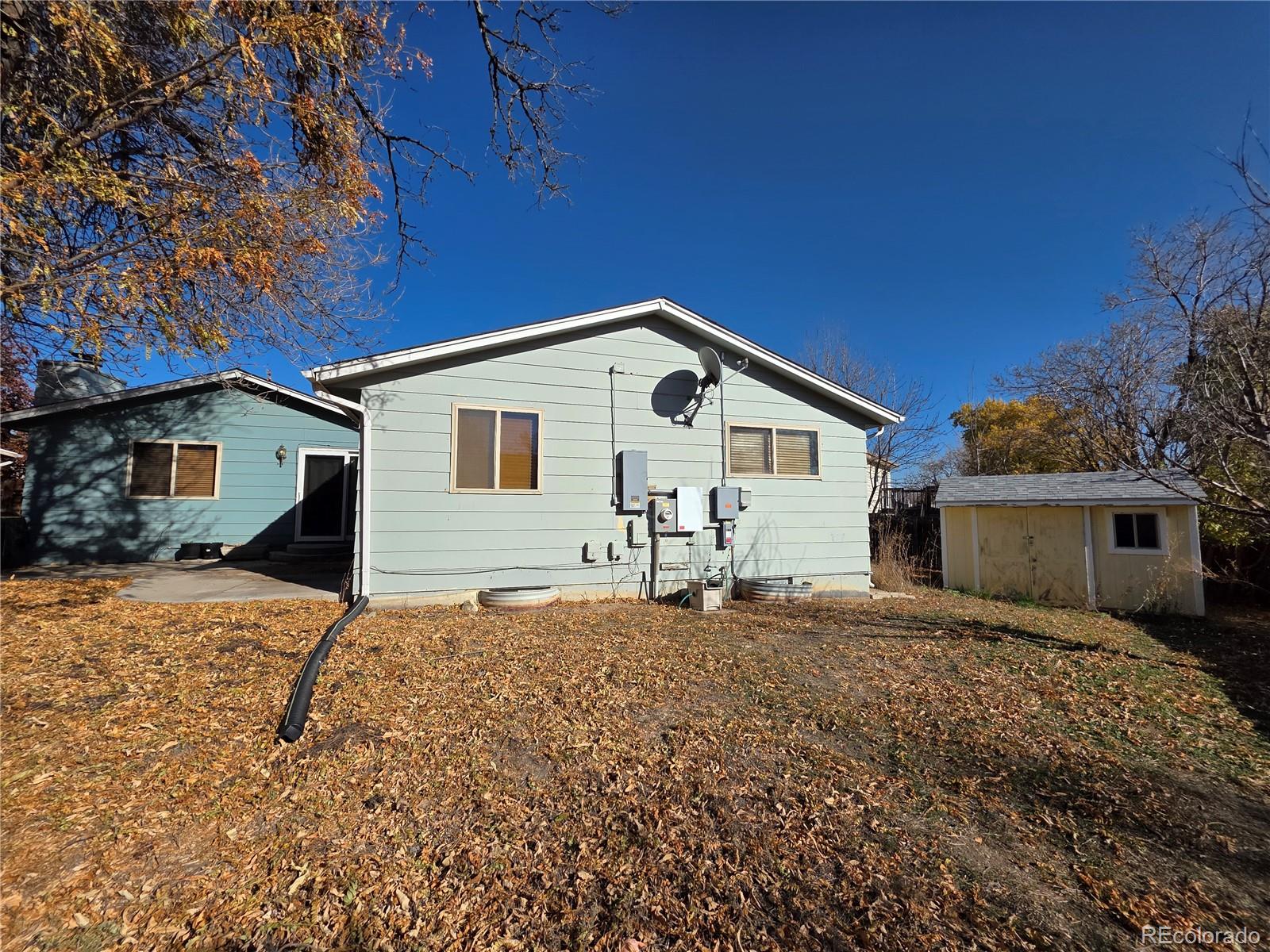 10439 Independence Street Broomfield, CO 80021 - Photo 29 of 30 a view of a house with a yard