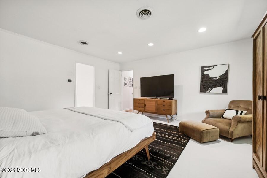 107 Rumson Road Rumson, NJ 07760 - Photo 20 of 46 a bedroom with a bed and a couch