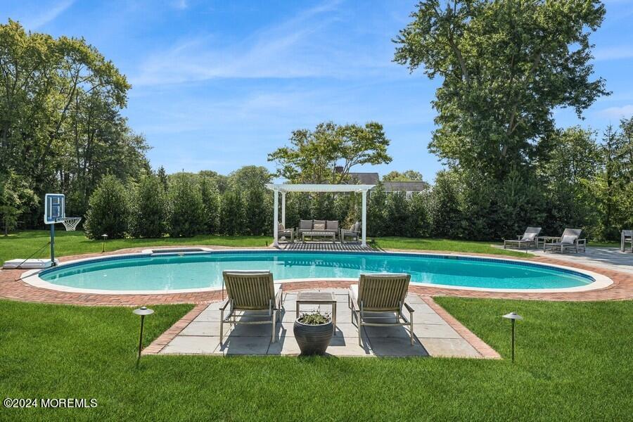 107 Rumson Road Rumson, NJ 07760 - Photo 34 of 46 a view of a swimming pool with a big yard
