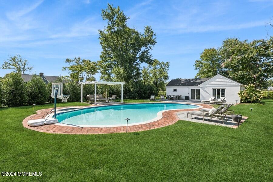107 Rumson Road Rumson, NJ 07760 - Photo 36 of 46 a view of house with swimming pool and yard