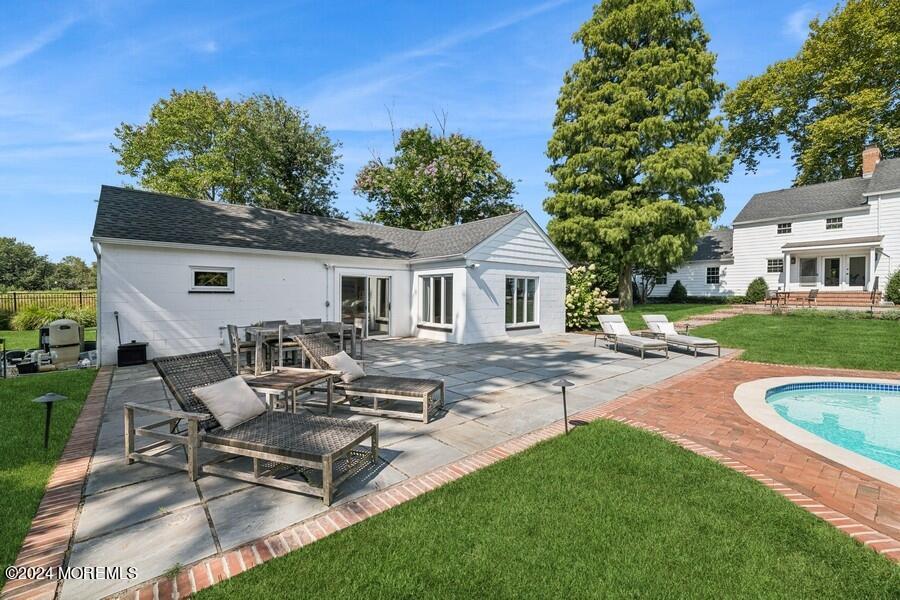 107 Rumson Road Rumson, NJ 07760 - Photo 37 of 46 a view of a white house with a patio