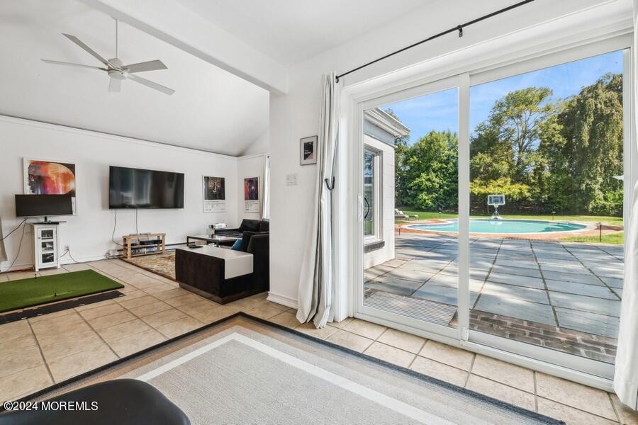107 Rumson Road Rumson, NJ 07760 - Photo 40 of 46 a living room with patio furniture and a flat screen tv
