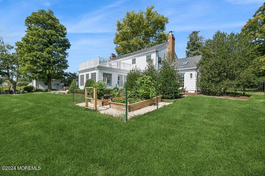 107 Rumson Road Rumson, NJ 07760 - Photo 42 of 46 a view of a house with a yard and sitting area