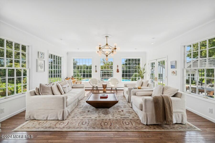 107 Rumson Road Rumson, NJ 07760 - Photo 8 of 46 a living room with furniture large windows and wooden floor