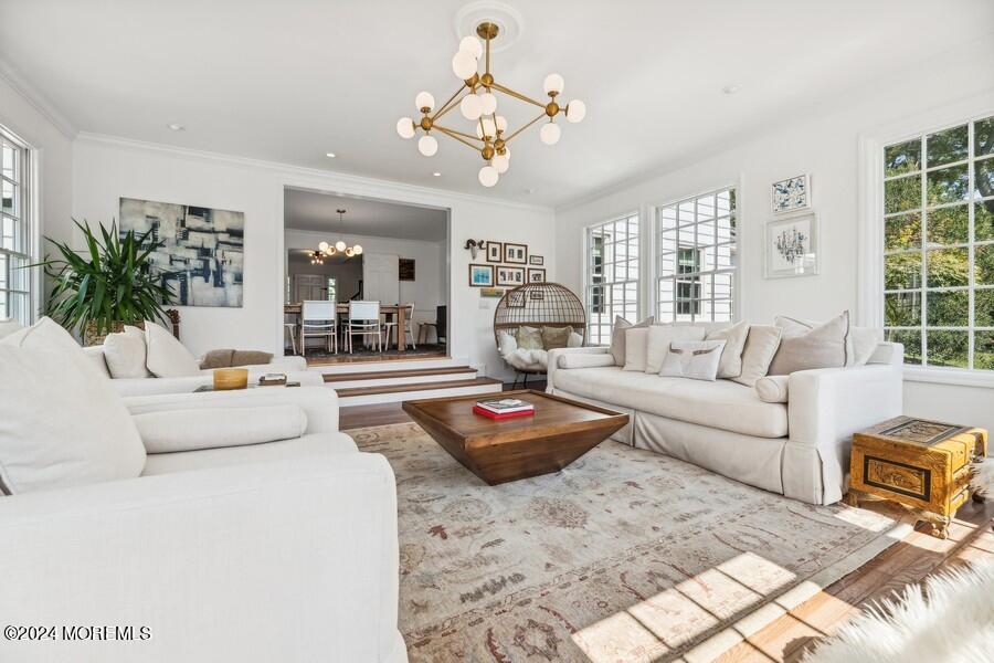 107 Rumson Road Rumson, NJ 07760 - Photo 9 of 46 a living room with furniture and a chandelier