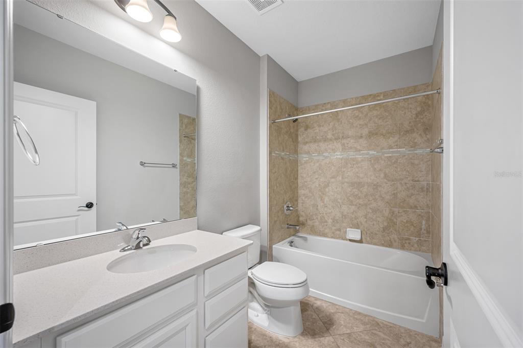 11230 High Noon Trail Parrish, FL 34219 - Photo 20 of 40 a bathroom with a sink toilet and shower