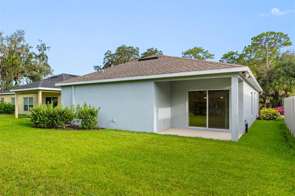 11230 High Noon Trail Parrish, FL 34219 - Photo 27 of 40 a front view of a house with garden