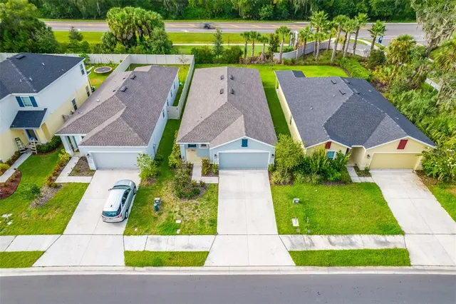 an aerial view of a wooden play house with a yard